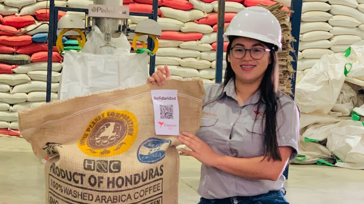 Angélica Paz, member of Capucas, shows the 100% traceable Honduran coffee