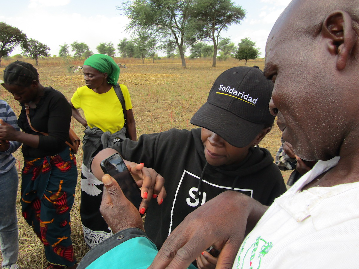 farmers entering data on digital tools