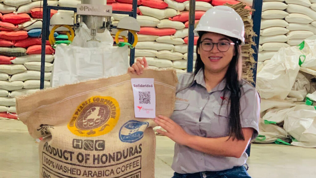 LATAM - Market Uptake - Angélica Paz from Capucas Cooperative in Honduras shows one of the traceable coffee bags shipped to Europe