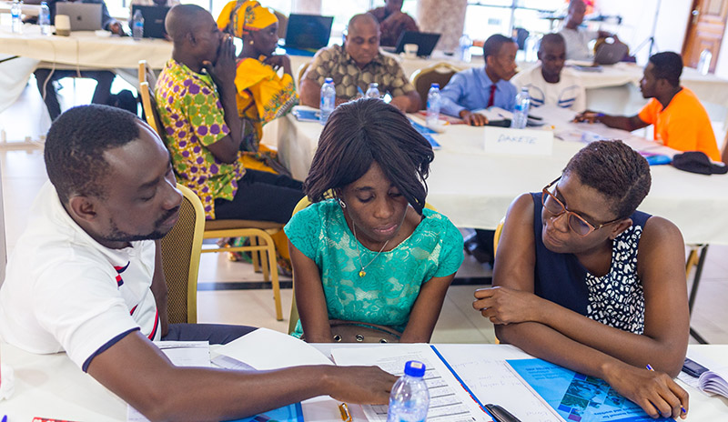 SCORE training participants during a working session